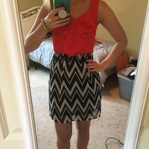 Red, white, and black dress with bow in front